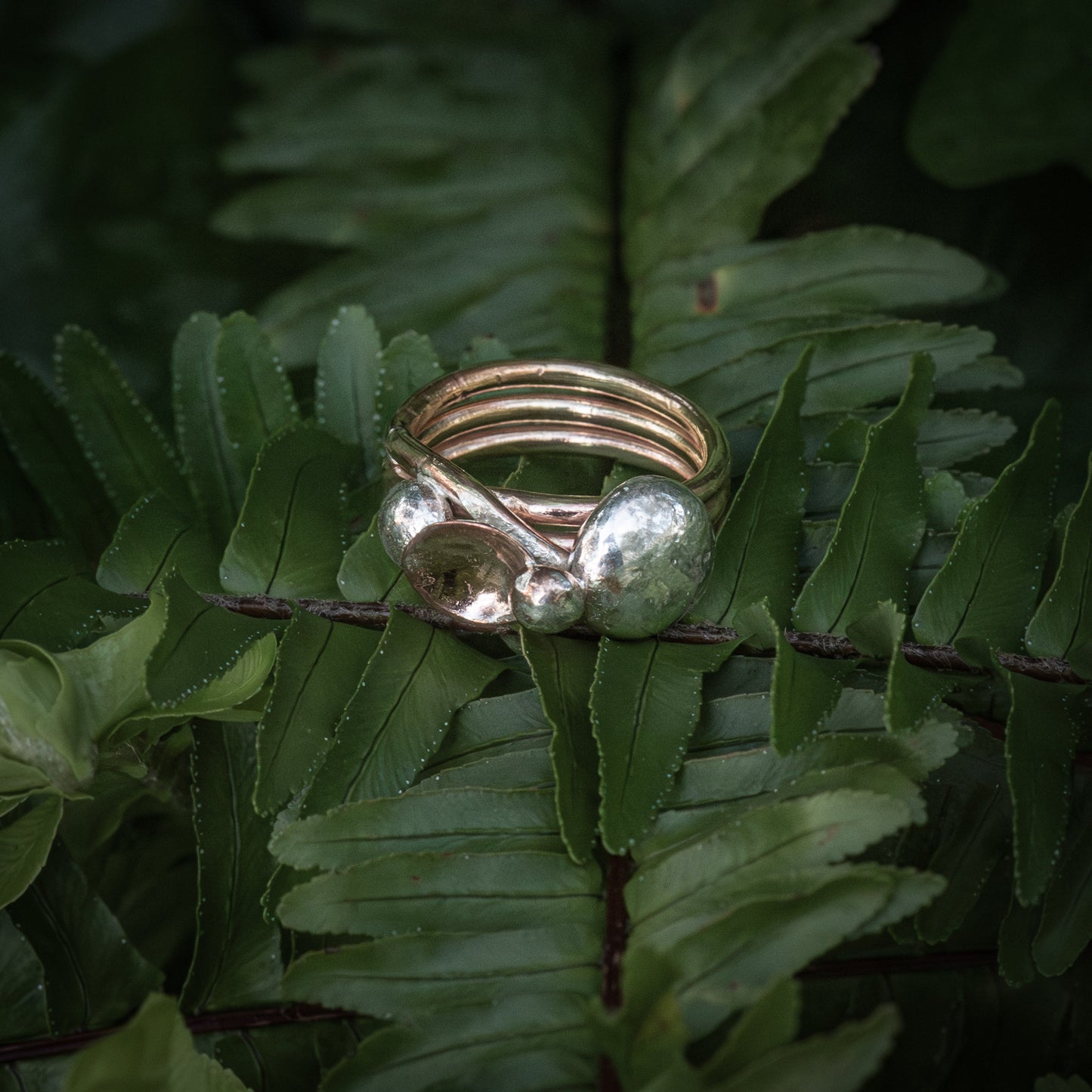 Brass spun ring, three twists with solid sterling silver nuggets.